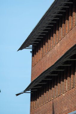 Permanent sun shade outside office windows.