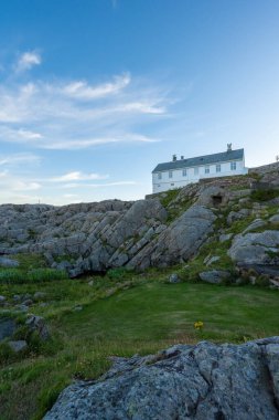 Lindesnes, Norway - August 05 2022: Cliffs around the lighthouse station at Lindesnes.