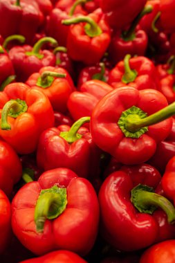 Big pile of red peppers in a store.