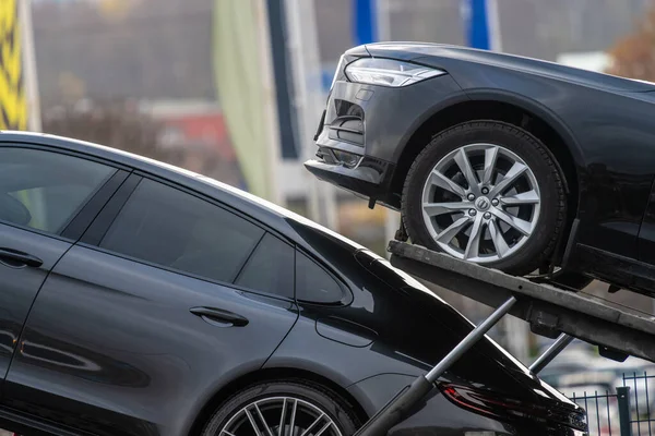 stock image Gothenburg, Sweden - november 09 2022: New Porsche and Volvo cars stacked neatly onto a car transport.