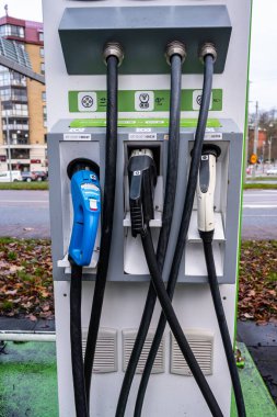 Gothenburg, Sweden - november 13 2022: Chademo CCS and Type 2 cables at electric car charger at Linneplatsen.