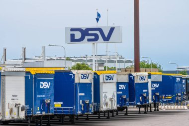 Gothenburg, Sweden - July 24 2022: Row of blue DSV freight trailers at a parking lot.