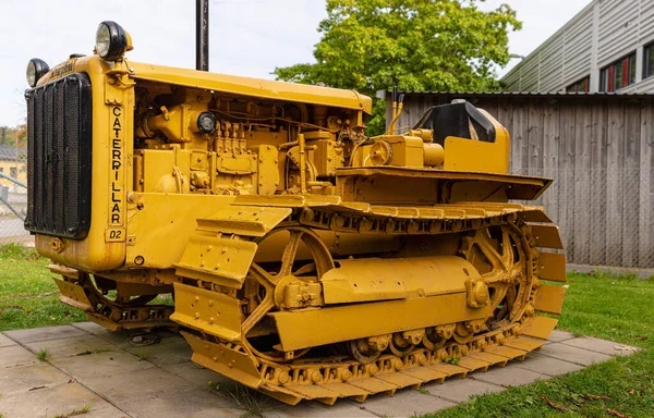 stock image Molndal, Sweden - september 19 2021: Details of a yellow old Caterpillar D2 bulldozer.