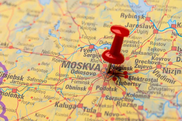 Red map pin on a map of Moscow.