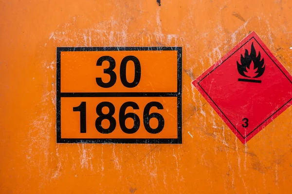 stock image Gothenburg, Sweden - July 24 2022: Orange universal tank container marked UN 30 1866 Resin Solution flammable.