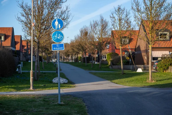 stock image Walking and bike lane between identical houses.