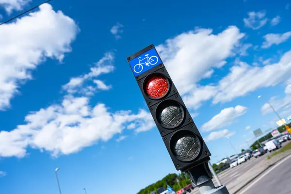 Looking up on a red bicycle traffic light.