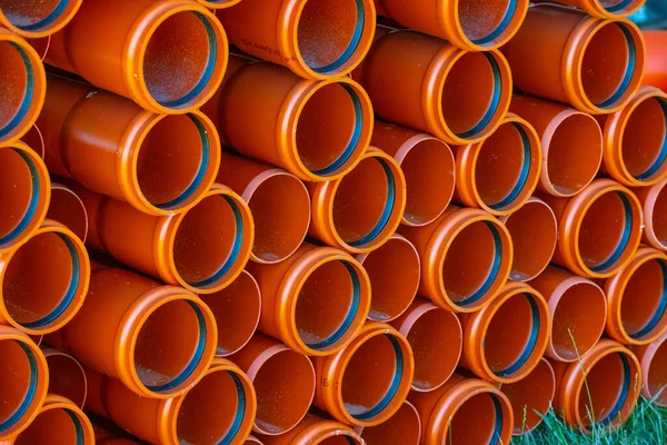 Large Pile Orange Plastic Pvc Pipes — Stock Photo, Image