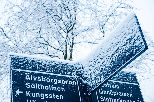 Gothenburg, Sweden - February 14 2012: Heavy snow on a bike road sign.