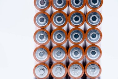 Four stacks of AA alkaline batteries