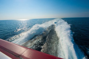ocean wake behind fast-moving vessel