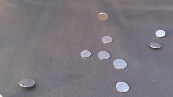 One Two Rupees Indian Coins Dropping Black Paper Floor Slow — Stockvideo