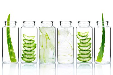 Homemade skin care aloe vera and aloe vera gel in glass bottles isolated on white background.