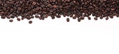 Dark roasted coffee beans setup on white background with copy space.