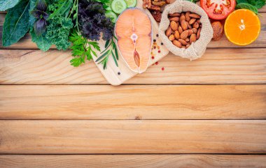 Ketogenic low carbs diet concept. Ingredients for the healthy foods selection  set up on wooden background