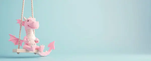 Çocukların salıncağındaki sevimli pembe oyuncak açık mavi arka planda izole edilmiş, kopyalama alanı..