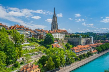 Aare river and Bern Minster, cathedral in the old city of Bern in Switzerland clipart