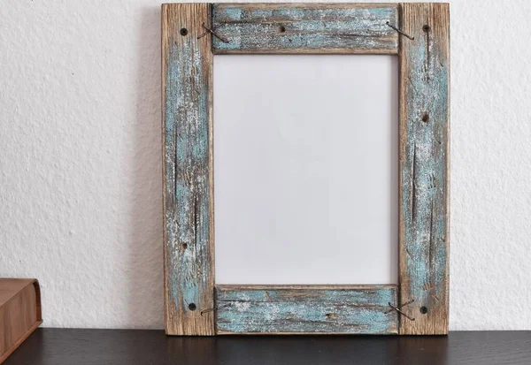 wooden frame and jewelry box on the table