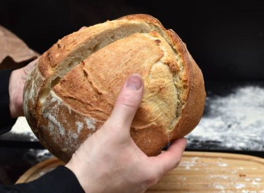 woman holding bread in her hands
