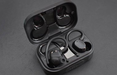 wireless sports headphones on a black background