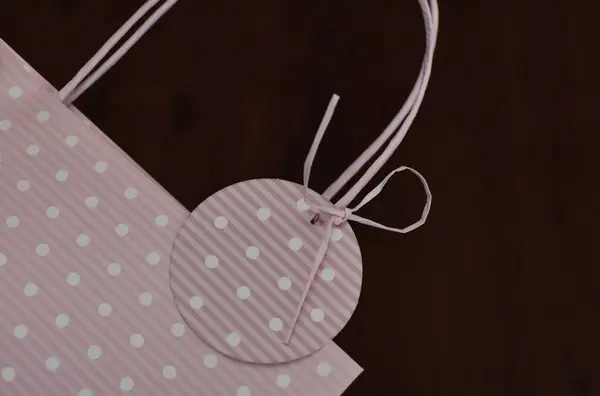 Pink Paper Bag White Polka Dots Dark Background — Stock Photo, Image