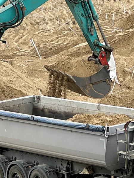Excavator Pours Sand Bucket Back Truck — Stock Photo, Image