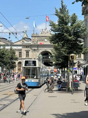 zurich switzerland 07.16.2024,tram and people near the main station clipart