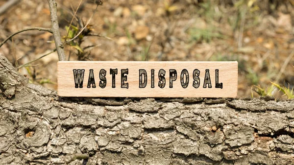 Waste disposal word. Background log written on wooden frame. Nature and life