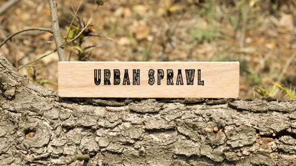 Urban sprawl word. Background log written on wooden frame. Nature and life