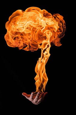 fireball on a male hand with black background