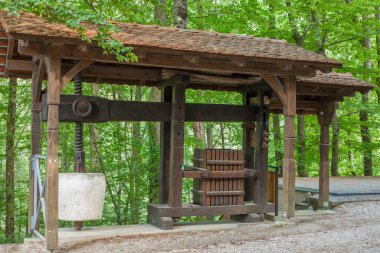 Old wooden wine press for pressing grapes for produce wine.