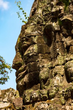 Angkor, Siem Reap, Cambodia, Carved stone faces on the entrance gateway to Banteay Kdei. One of the temples within the Angkor complex clipart