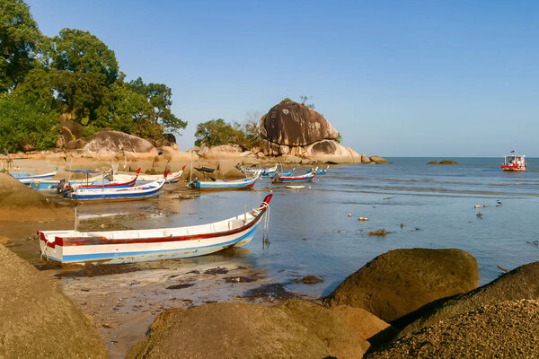 Malaysian fishing village, beach scene with traditional boats