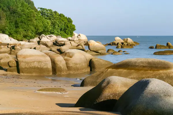Tropical beach landscape with large rock formations, Malaysia