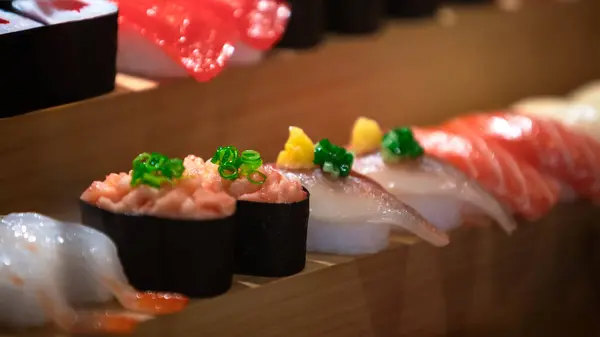 The artificial duplicates of sushi. The restaurant proudly displays plastic renditions of traditional Asian sashimi dishes, offering a visual feast before the culinary journey begins.