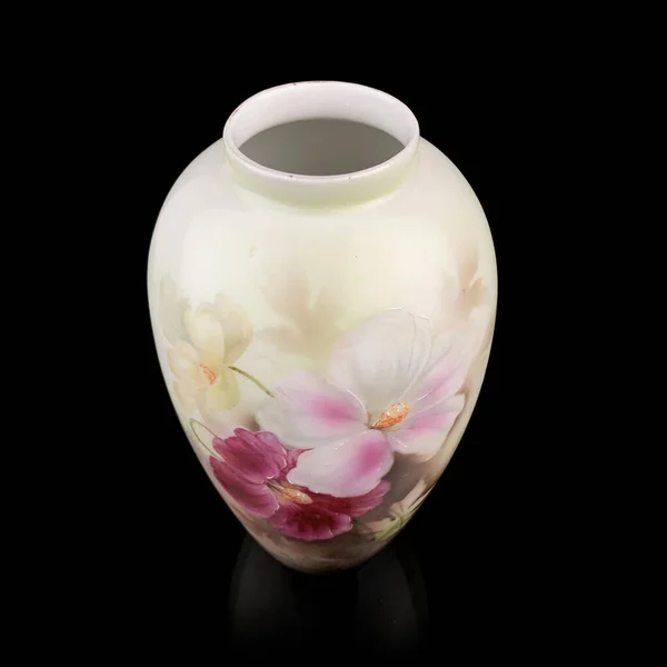 beautiful vase with a flower pattern on a black isolated background. antique porcelain vase with painting