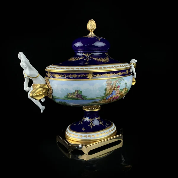antique flower vase with Dutch painting. antique English porcelain. art painting of dishes. renaissance vase