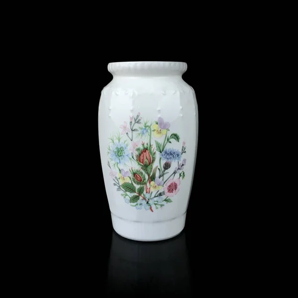 beautiful vase with a flower pattern on a black isolated background. antique porcelain vase with painting