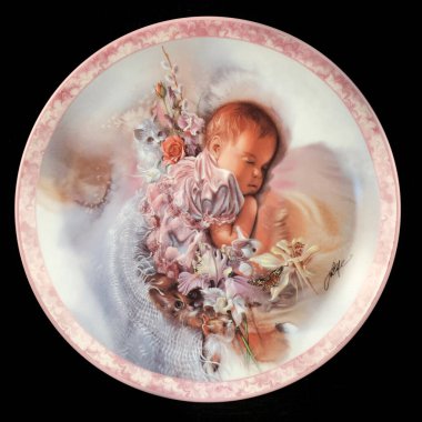 Round picture for decoupage depicting a Little girl. antique plate on black isolated background