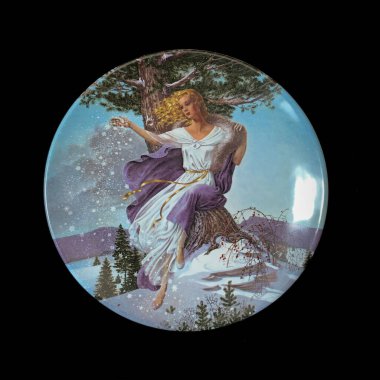 Virgin Mary with baby Jesus on a white plate on a black background. Round picture for decoupage.