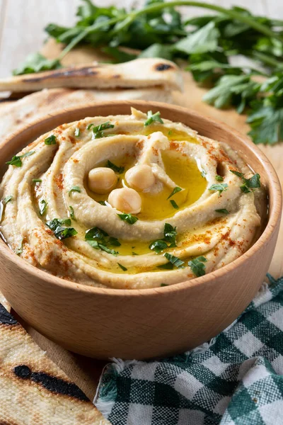 Chickpea Hummus Wooden Bowl Garnished Parsley Paprika Olive Oil Wooden — Stock Photo, Image