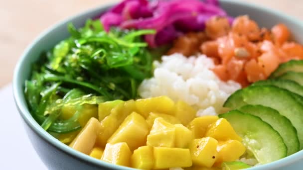 Poke Bowl Rice Salmon Cucumber Mango Onion Wakame Salad Poppy — Stock videók