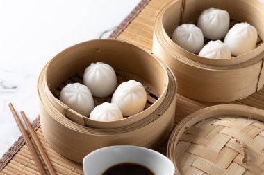 Steamed dumplings on marble background
