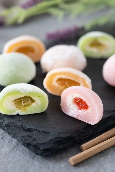 stock image Japanese colorful mochi on gray stone surface. Close up