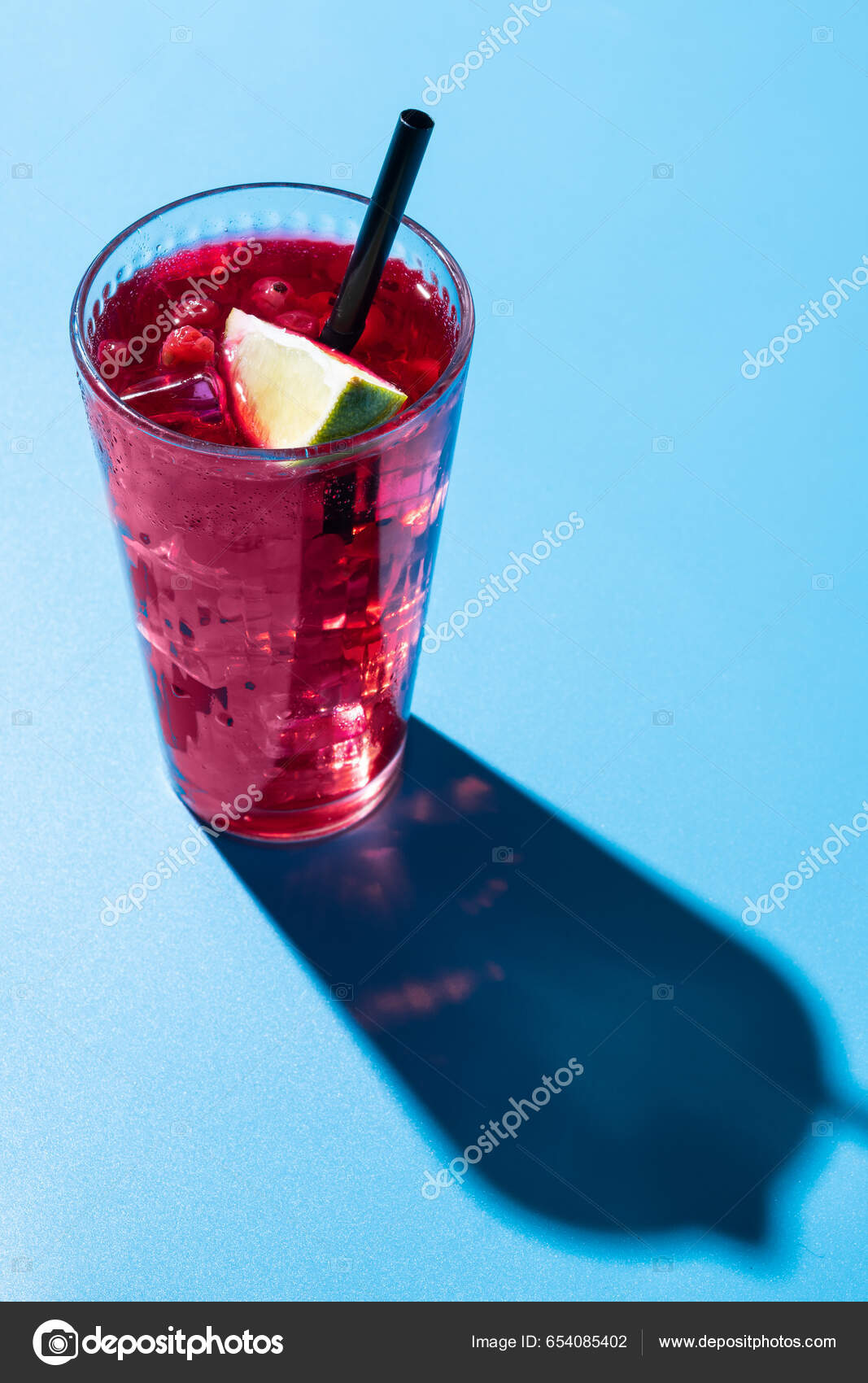 Cape Codder Cocktail Vodka Cranberry Juice Lime Blue Background