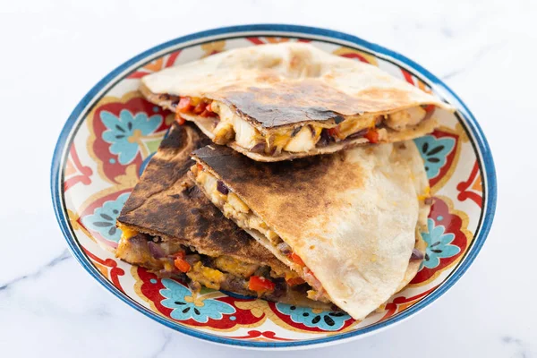 stock image Mexican chicken quesadillas with cheese and peppers on white marble