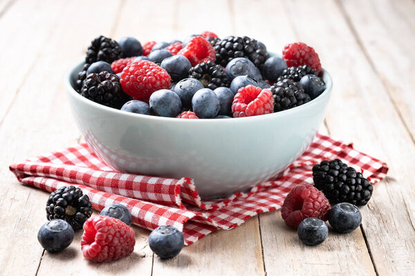 Fresh assortment berries on wooden table