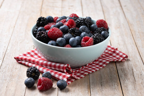 Fresh assortment berries on wooden table