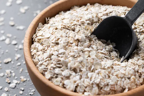 Rolled Oats Healthy Breakfast Cereal Oat Flakes Black Slate Background Stok Foto