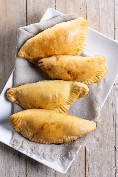 stock image Pumpkin empanadillas for Halloween or Thanksgiving's Day on wooden table